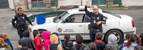 Officers giving a demonstration to school kids
